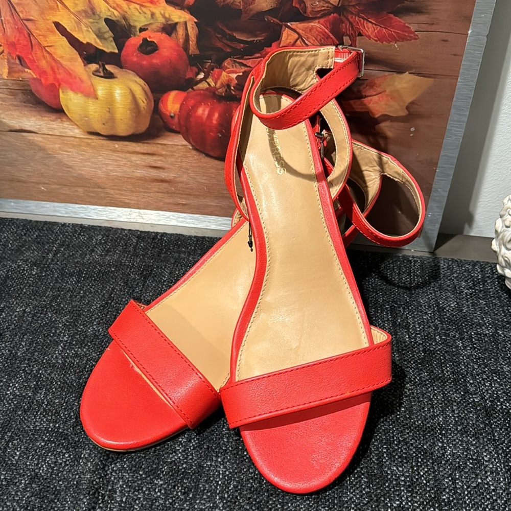Red express heeled ankle strapped shoes